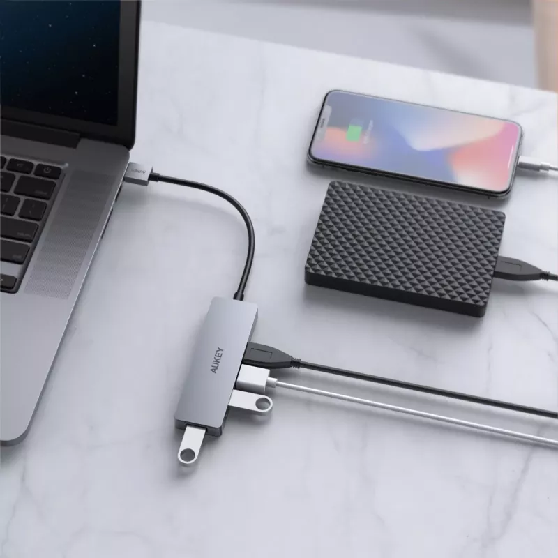 USB šakotuvas Aukey CB-H36 — 4 prievadai USB 3.2 Gen 1 Type-A, pagrindinis USB 2.0, 5000 Mbit/s, aliuminis sidabrinis