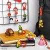 Backpack Buddies raktų pakabukų rinkinys Paladone Super Mario, CDU, 24 vnt. – įvairūs veikėjai, kolekcionuojami aksesuarai