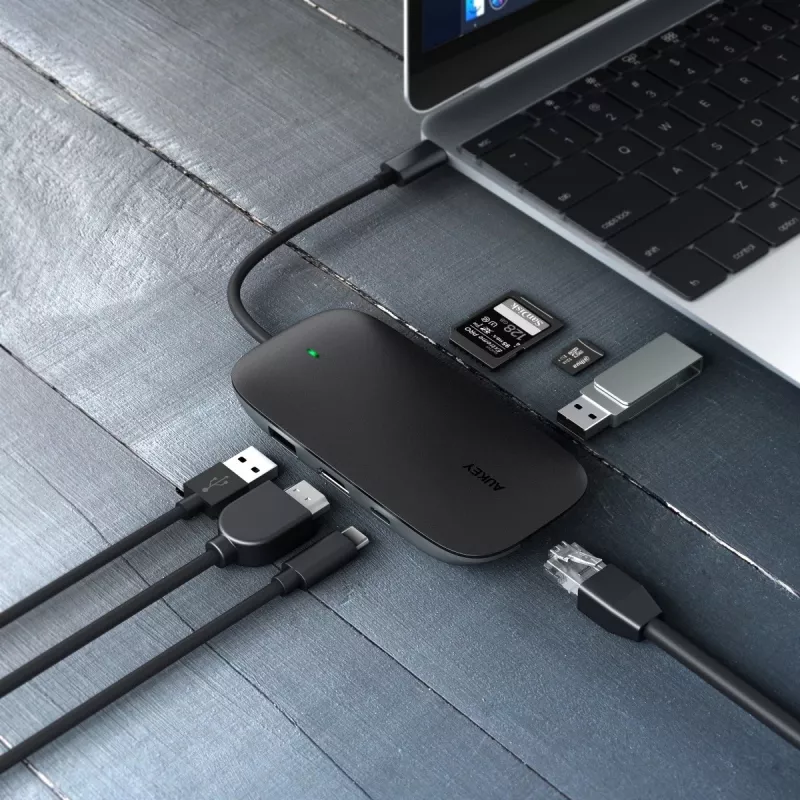 USB-C stotelė nešiojamam kompiuteriui AUKEY CB-C71 — 3x USB‑C (USB 3.2 Gen1), HDMI, RJ‑45, MicroSD, USB PD 100W, 0,15 m kabelis, juoda