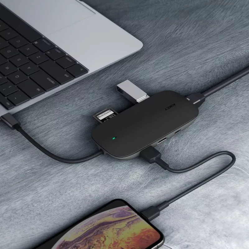 USB-C stotelė nešiojamam kompiuteriui AUKEY CB-C71 — 3x USB‑C (USB 3.2 Gen1), HDMI, RJ‑45, MicroSD, USB PD 100W, 0,15 m kabelis, juoda