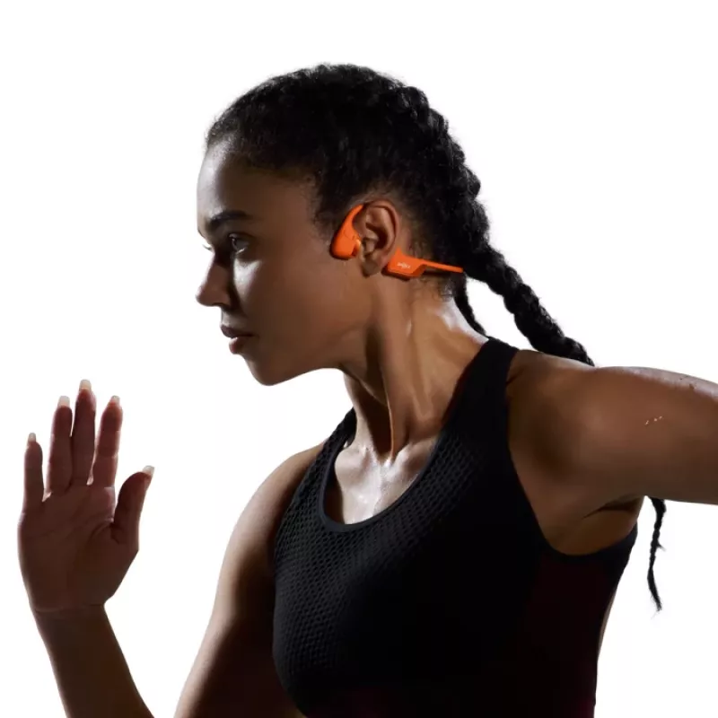 Kaulų laidumo ausinės Shokz OpenRun Pro 2 – belaidės Bluetooth 5.3, IP55, 12 h veikimo, 150 mAh, oranžinė, užkabinamos