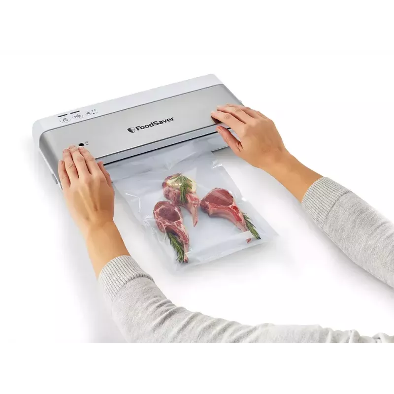 Vakuuminis maisto pakuotuvas FoodSaver VS0100X su sukamuoju valdikliu, komplekte ritinys ir 4 maišeliai, sidabriškai baltas