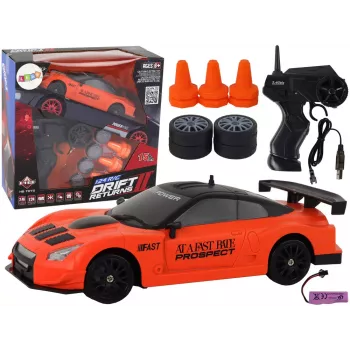 LEAN TOYS nuotoliniu valdymu sportinis automobilis R/C 1:24 oranžinis su keičiamais ratais