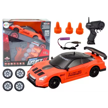 LEAN TOYS nuotoliniu valdymu valdomas sportinis automobilis 1:24 oranžinis su keičiamais ratais