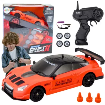 LEAN TOYS nuotoliniu valdymu valdomas sportinis automobilis 1:24 oranžinis su keičiamais ratais