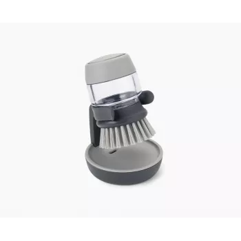 Joseph Joseph Palm Scrub Grey indų šepetys su integruotu muilo dozatoriumi