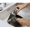 Joseph Joseph Palm Scrub Grey indų šepetys su integruotu muilo dozatoriumi