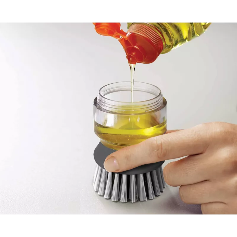 Joseph Joseph Palm Scrub Grey indų šepetys su integruotu muilo dozatoriumi