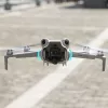 SUNNYLIFE Objektyvo gaubtas, skirtas DJI Mini 4 Pro dronui – apsauga nuo akinimo, juodas