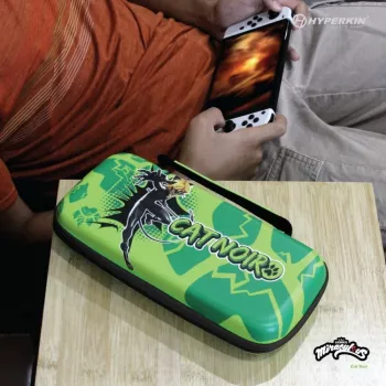 Hyperkin M07541-MTCN kietas dėklas, žalias, įvairiaspalvis, PEVA, skirtas Nintendo Switch Lite, atsparus smūgiams, vandeniui atsparus, nešiojimo krepšys
