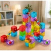 LEAN TOYS Magnetiniai statybiniai blokeliai 60 vnt. – spalvotas kubelių ir kamuoliuko takelio konstravimo rinkinys